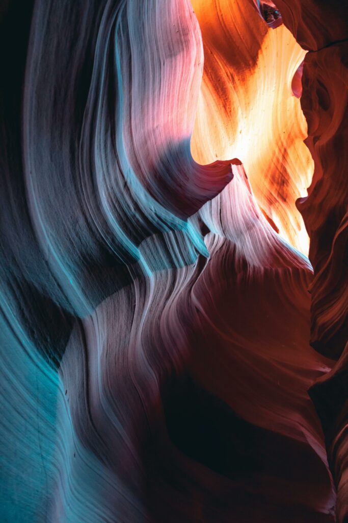 Explore the vibrant, swirling rock formations of Antelope Canyon with a stunning blend of colors and natural light.